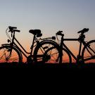 Two bicycles against a sunset