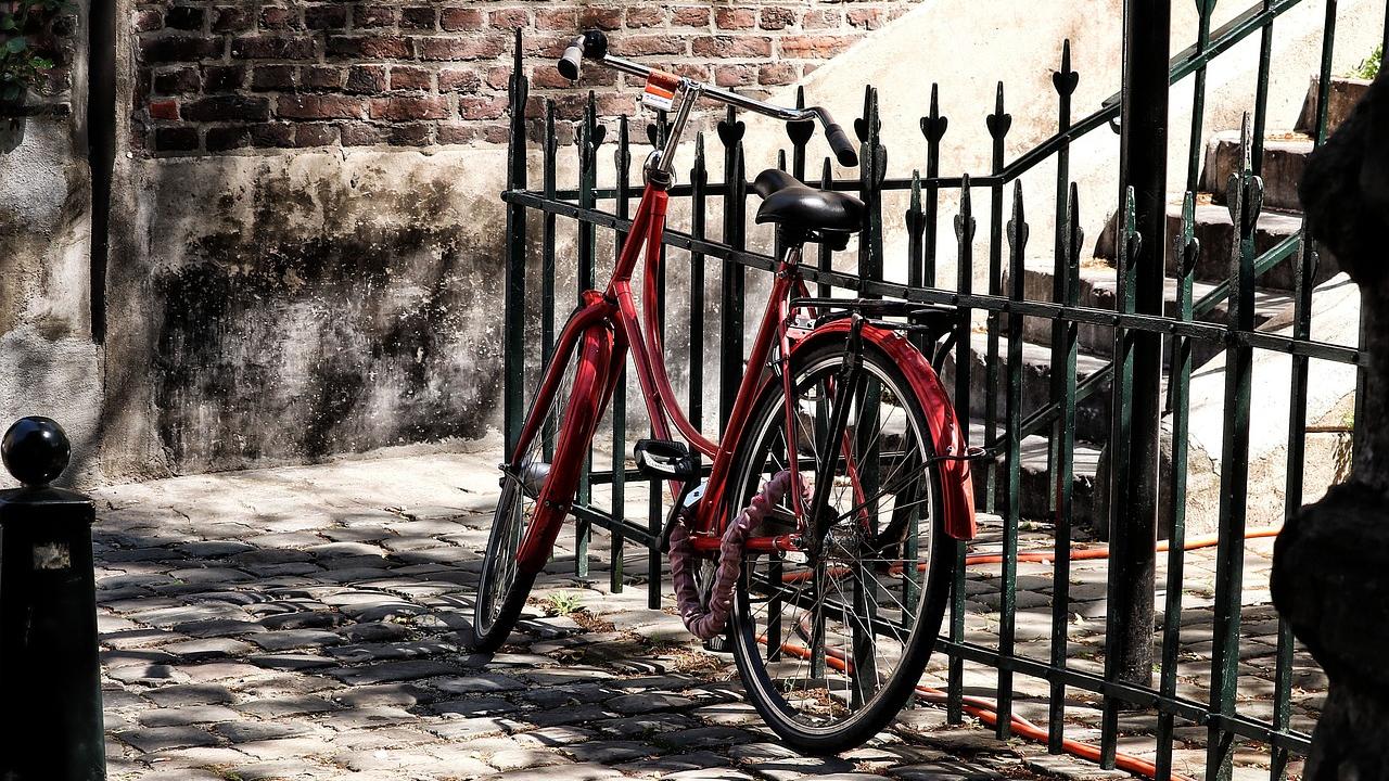 Bike leaning against a metal railing