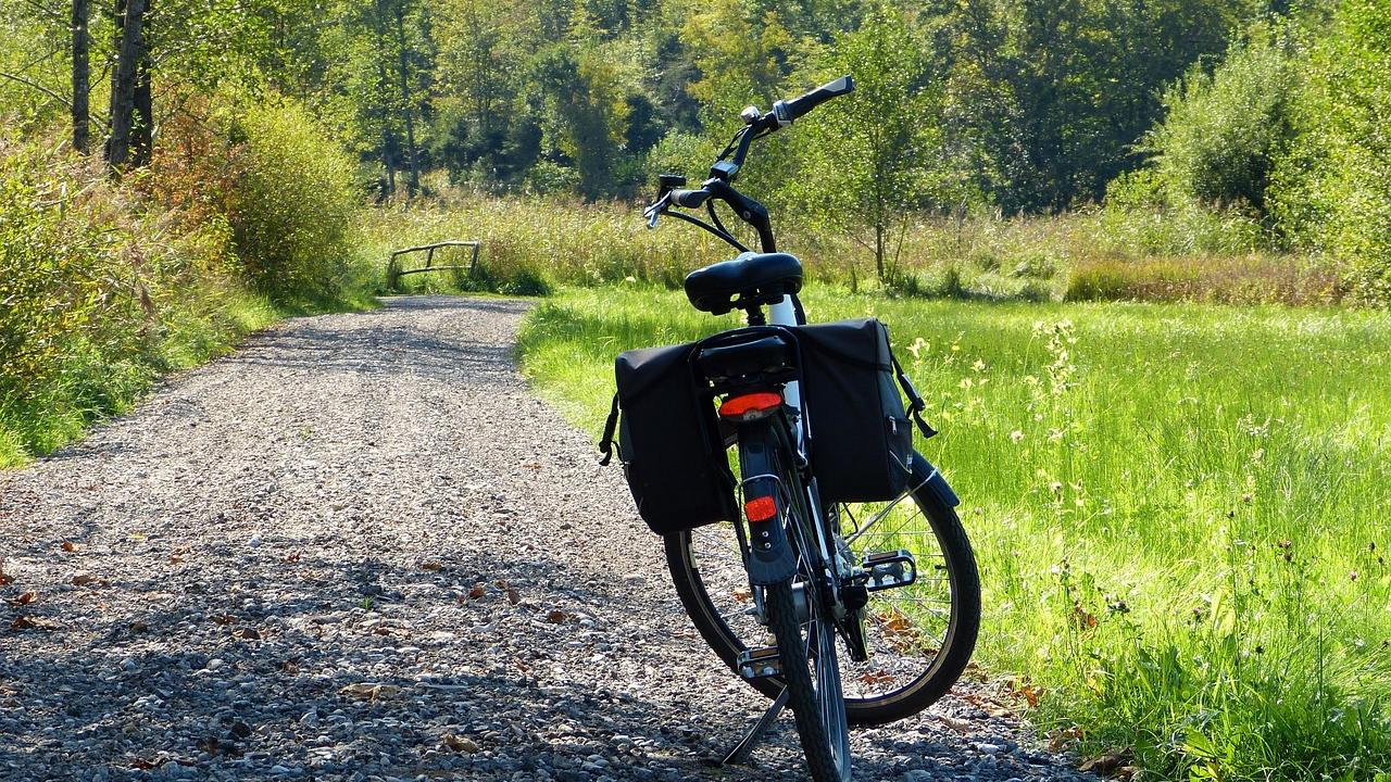 Bicycle parked on a dirt road