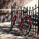 Bike leaning against a metal railing